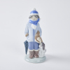 A Lladro Boy With Dog Figurine