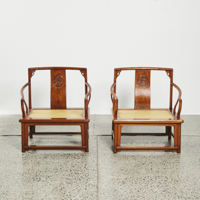 A pair of Chinese hardwood armchairs