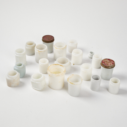 An Assortment of Vintage White Glass Jars