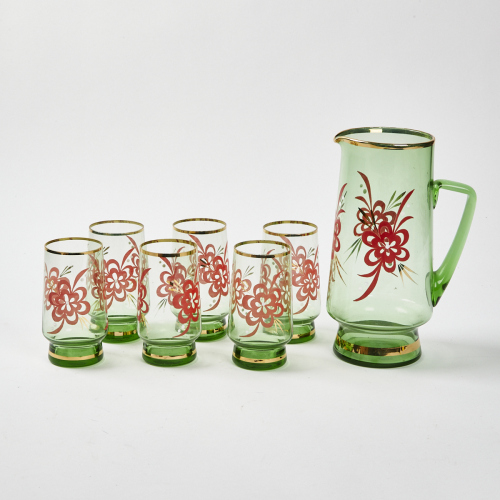 A Mid Century Green And Gold Glass Water Pitcher And Cups With Floral Detailing