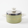 A Green and White Enamelled Saucepan with a Gold Retro Pattern