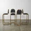 A Set of Four Bar Stools with Bases in the Style of Marcel Breuer