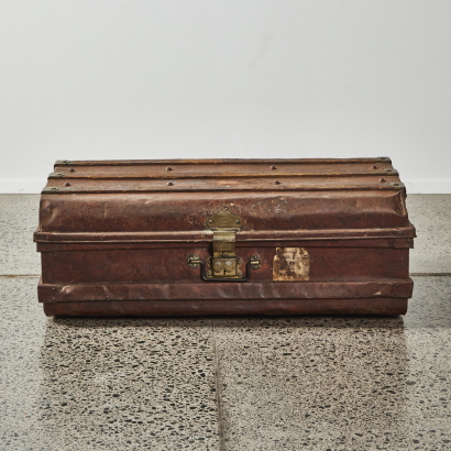 An Antique Metal Suitcase