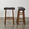 A Pair Of Wooden Barstools With Padded Seats