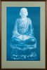 A Framed Picture Of A Buddha Statue