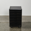 A Black File Cabinet On Castors