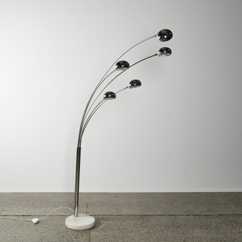 A Medusa Lamp With White Marble Base