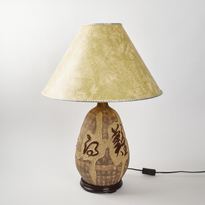 A Ceramic Lamp With Calligraphy Detail