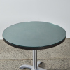 A Circular Dining Table With A Glass Overlay - 2