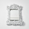 A Painted Silver Ornate Carved Mirror