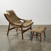 A Scandinavian Leather Sling Chair With Footstool