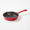 A Small Cast Iron Red Enamel Skillet