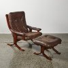 A Leather Danish Armchair With Foot Stool