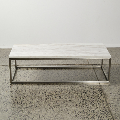 A Marble Topped Coffee Table With A Stainless Steel Base