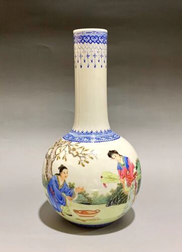 A Chinese Famille Rose Vase decorated with figures (Qianlong Mark)