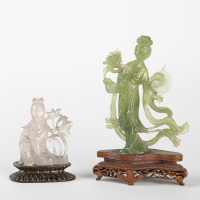 A set of two Chinese green jade and jadeite carved old ladies ornaments