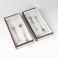 Two boxes of Korea painted enamels silver spoons and forks