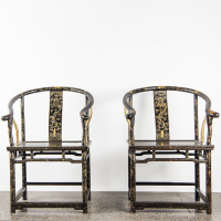 A pair of Chinese black lacquer and gilt dragon-phoenix motif armchairs