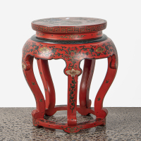 A Chinese red lacquer and gilt flower motifs round stool