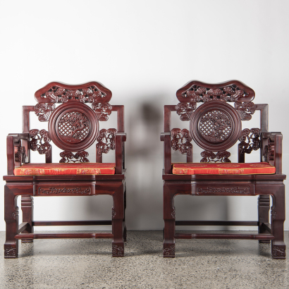 A pair of Chinese hardwood carved 'Lingzhi' armchairs