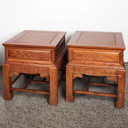 A pair of Chinese hardwood carved "flower" square tables