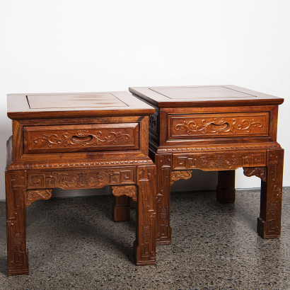 A pair of Chinese hardwood carved "flower" square tables