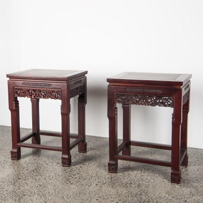 A pair of Chinese hardwood carved "flower" square tables