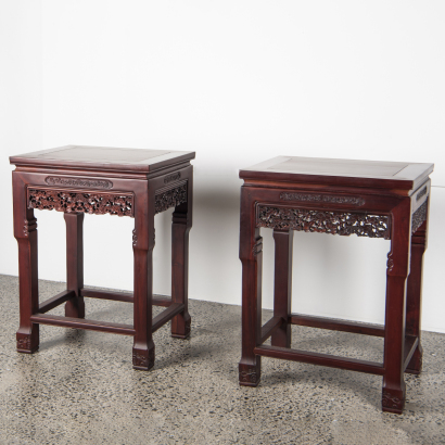 A pair of Chinese hardwood carved "flower" square tables