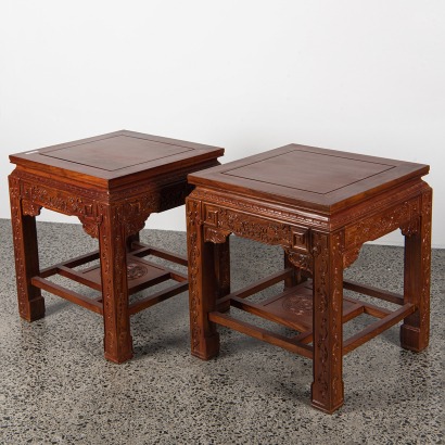 A pair of Chinese hardwood carved "flower" square tables