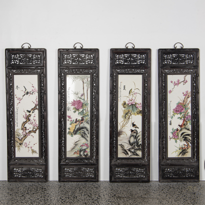 A set of four Chinese old wooden framed 'flowers and birds' plaques