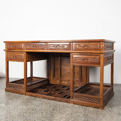 A Chinese hardwood carved desk