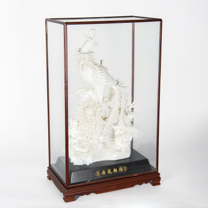 A Chinese white porcelain phoenix sculpture (original glass frame)