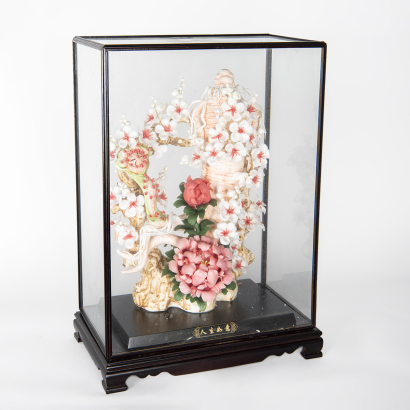 A Chinese white porcelain flower sculpture (original glass frame)