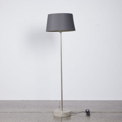 A Modern Floor Lamp With Cast Concrete Base