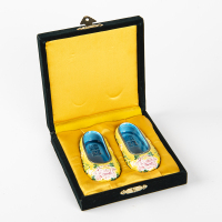 A pair of small embroidered shoes in Chinese Jiaozhi ware