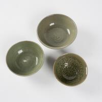 A group of three Chinese Ming Dynasty Celadon-glazed bowls