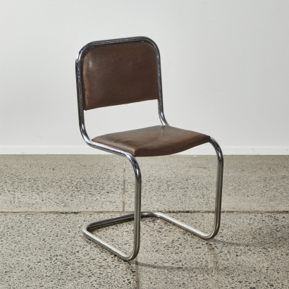 A Mid Century Chrome And Vinyl Cantilevered Chair