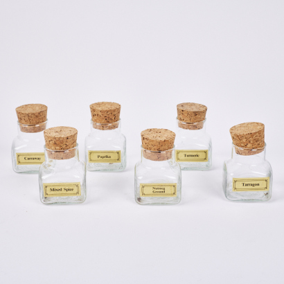A Set Of Six MidCentury Glass Spice Jars With Corks