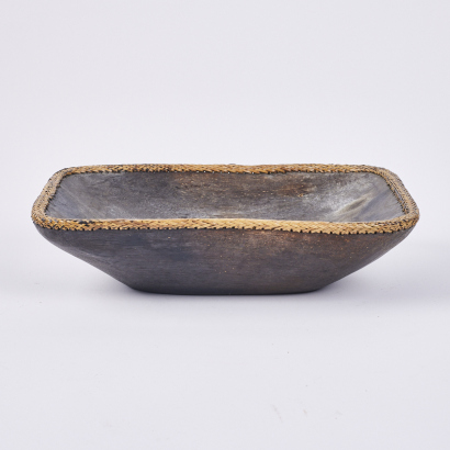 A Rectangular Wood Serving Dish with a Braided Rim