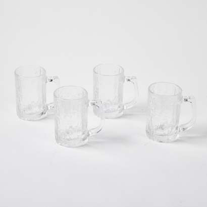 A Set Of Four Mid Century Hoya Carved Ice Glass Beer Mugs