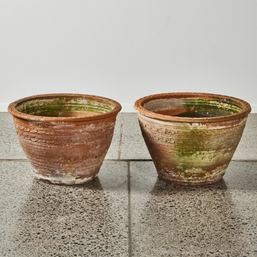 A Pair Of Large Patterned Terracotta Planters