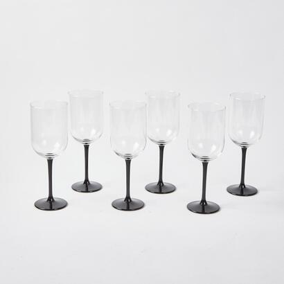 A Set Of Six Black Stemmed Champagne Flutes