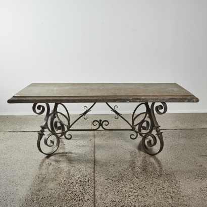 A Concrete Top Table With A Cast Iron Base