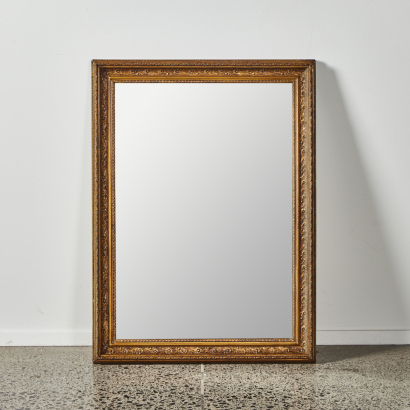 A Large Gold Framed Mirror