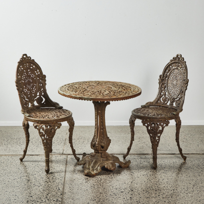 A French Cast Iron Outdoor Table And Pair Of Chairs