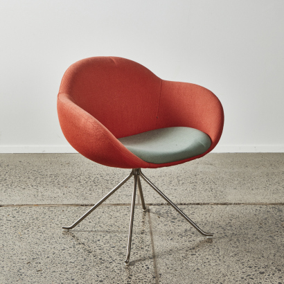 A Single Tub Chair With Stainless Base
