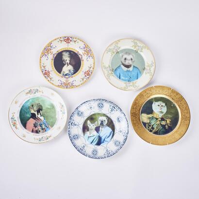 A Collection of Wall Plates of Figures with Animal Heads