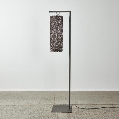 A Contemporary Floor Lamp With Rattan Shade