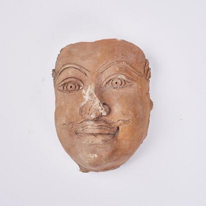 A Terracotta Face Sculpture