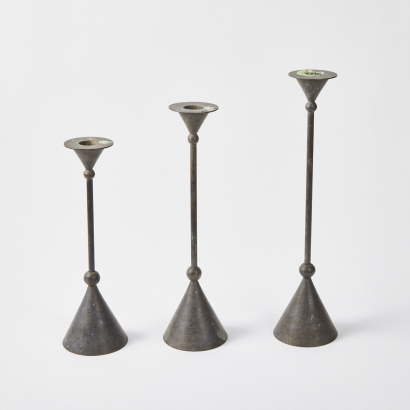 A Trio Of Candlestick Holders